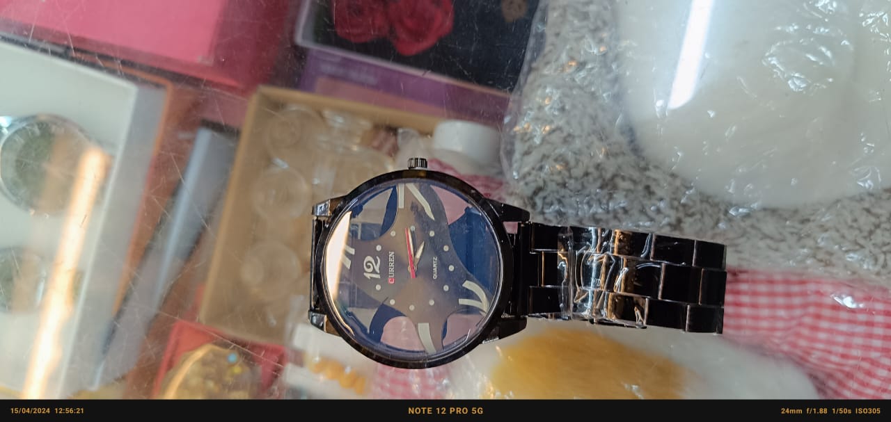 "Translucent Elegance: Black Chain Round Dial Watch"